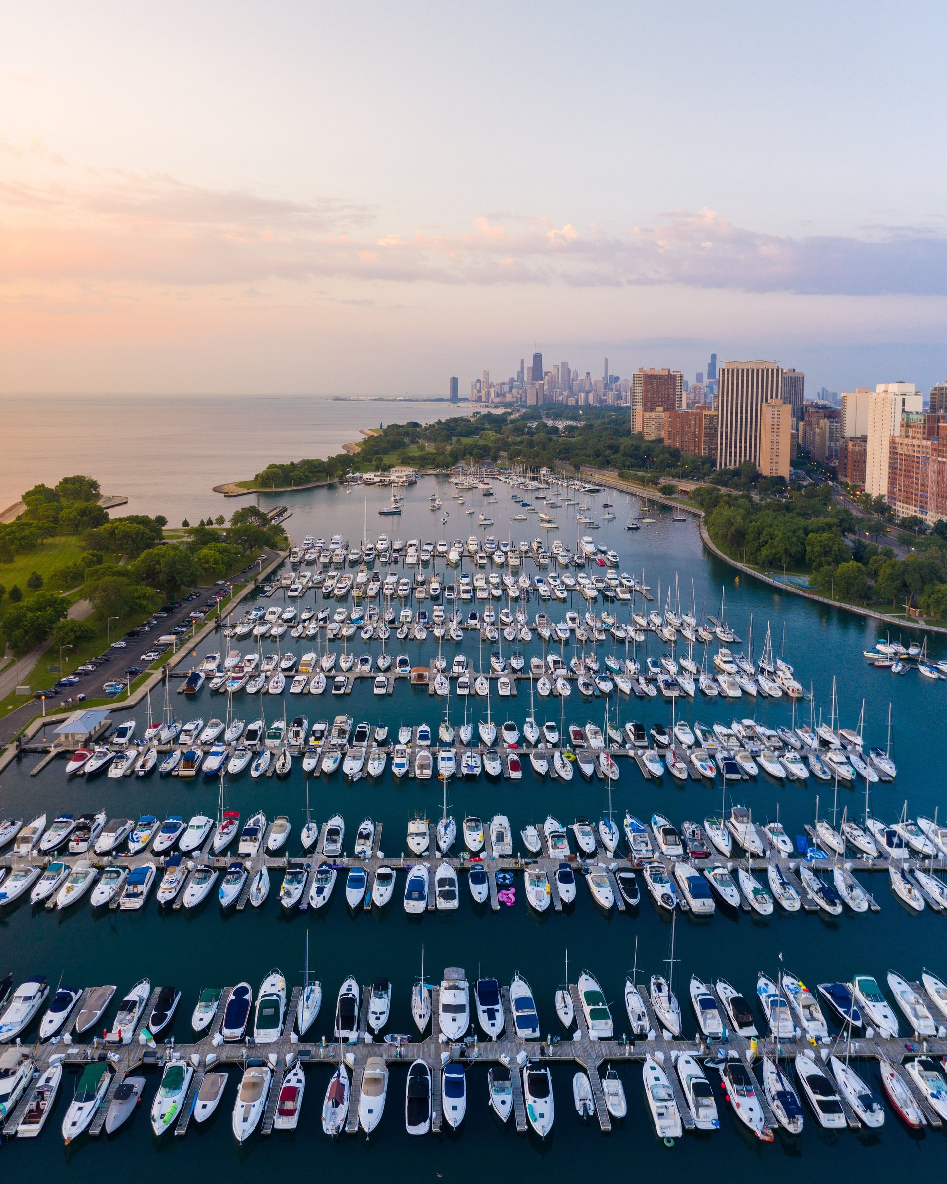 Marina with boats and Chicago skyline at dawn